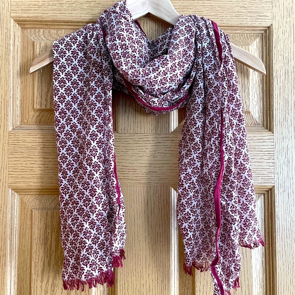 Cream and cranberry colored patterned scarf
